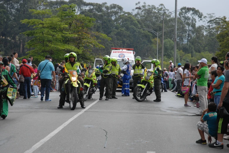 a group of people in costumes riding motorcycles down the street