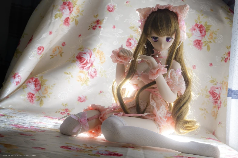 a close up of a doll on a bed