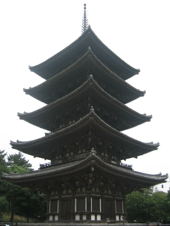 the very tall pagoda has a tower top