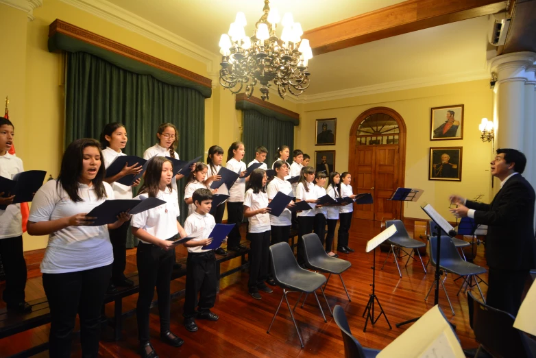 a group of people singing in a room