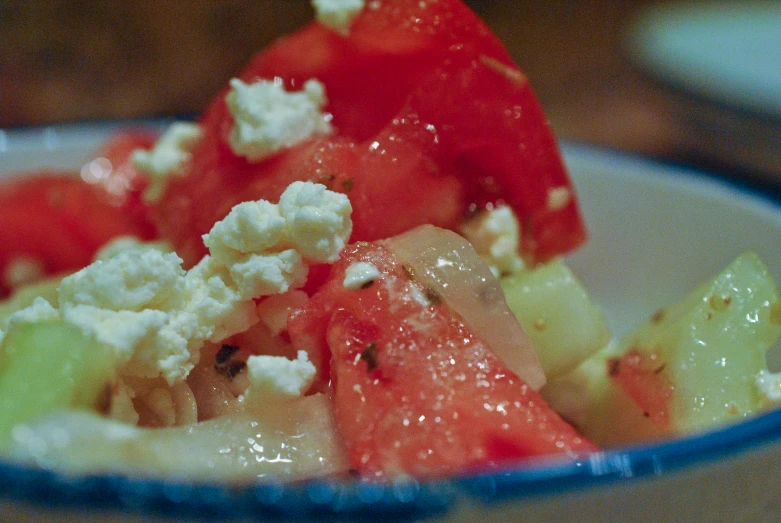 a plate topped with lots of fruit on a wooden table