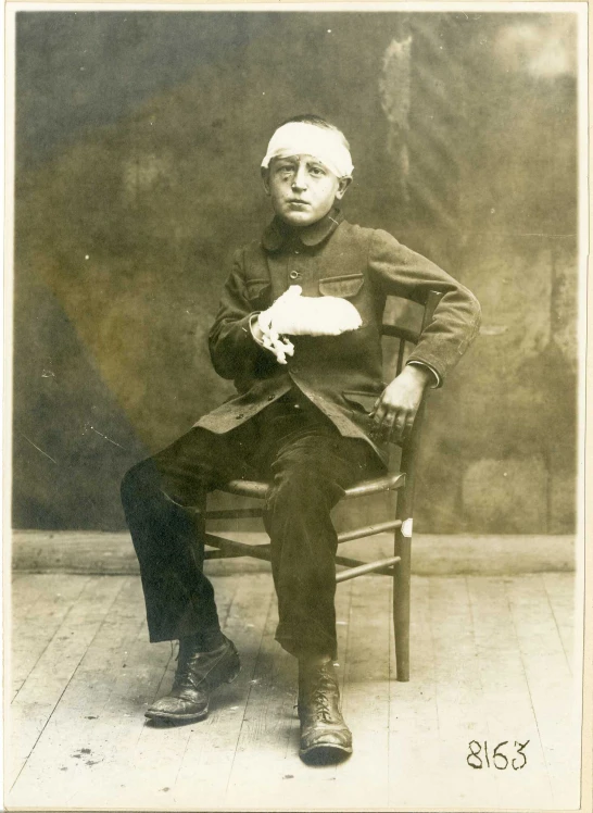 a man sitting in a chair with his legs crossed