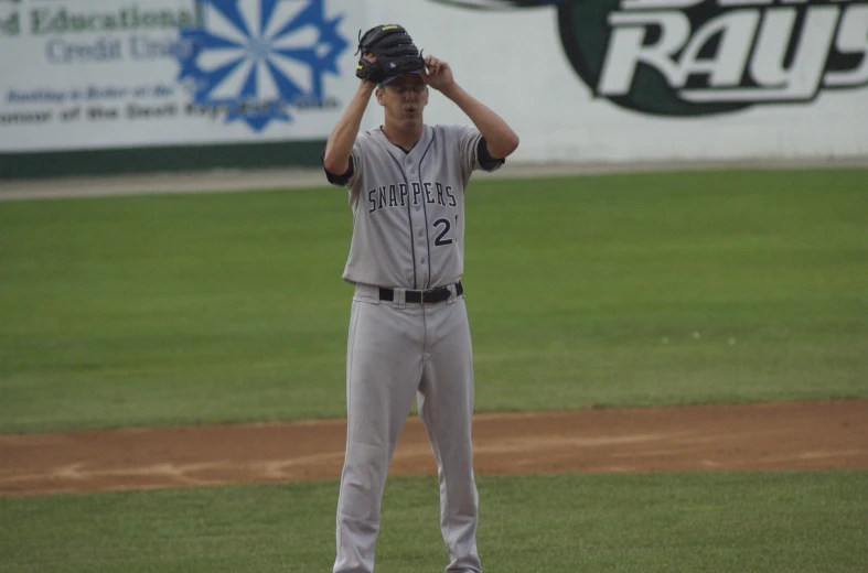 the man in a uniform is getting ready to pitch a baseball