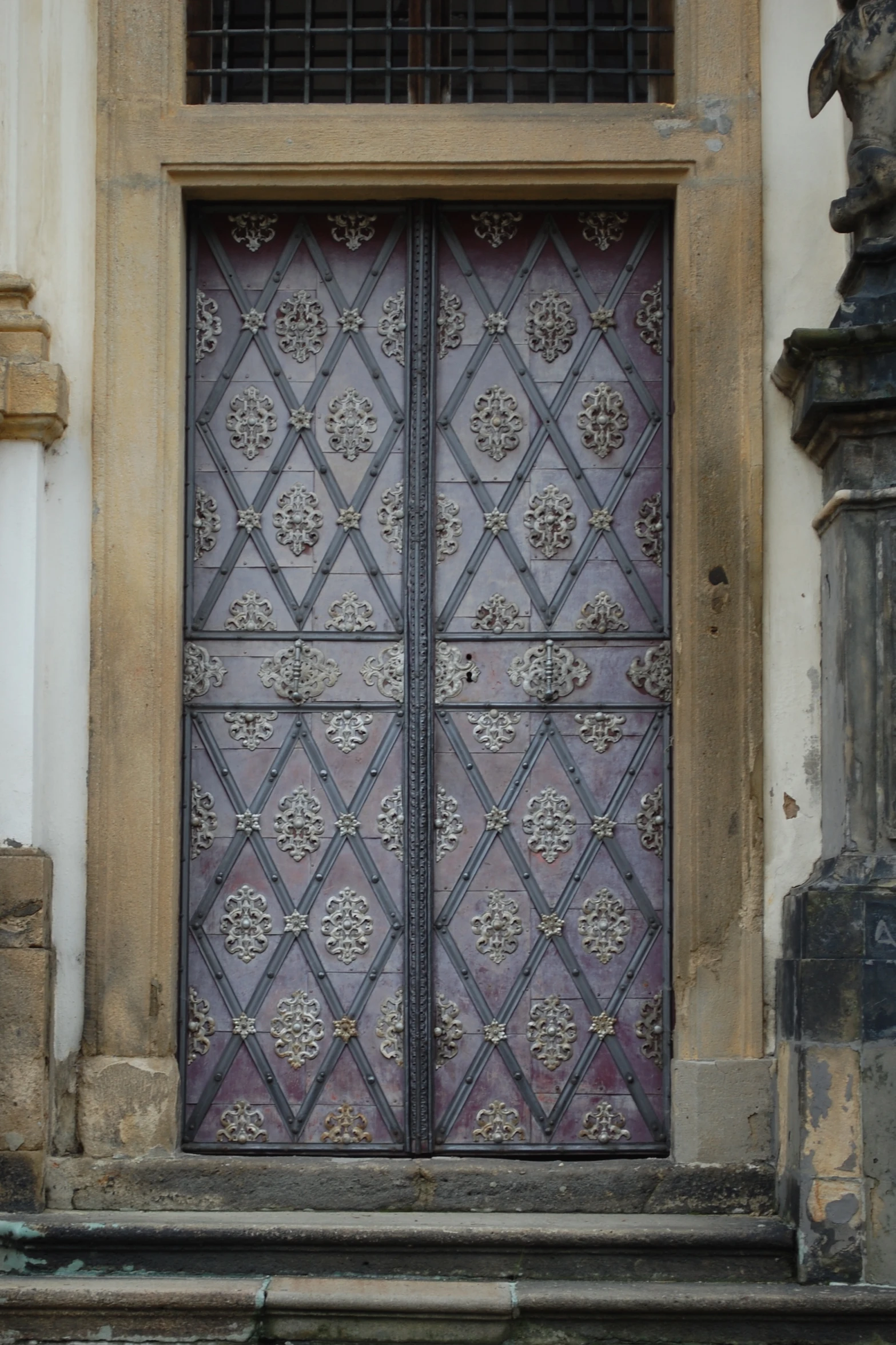 two large doors in front of a building