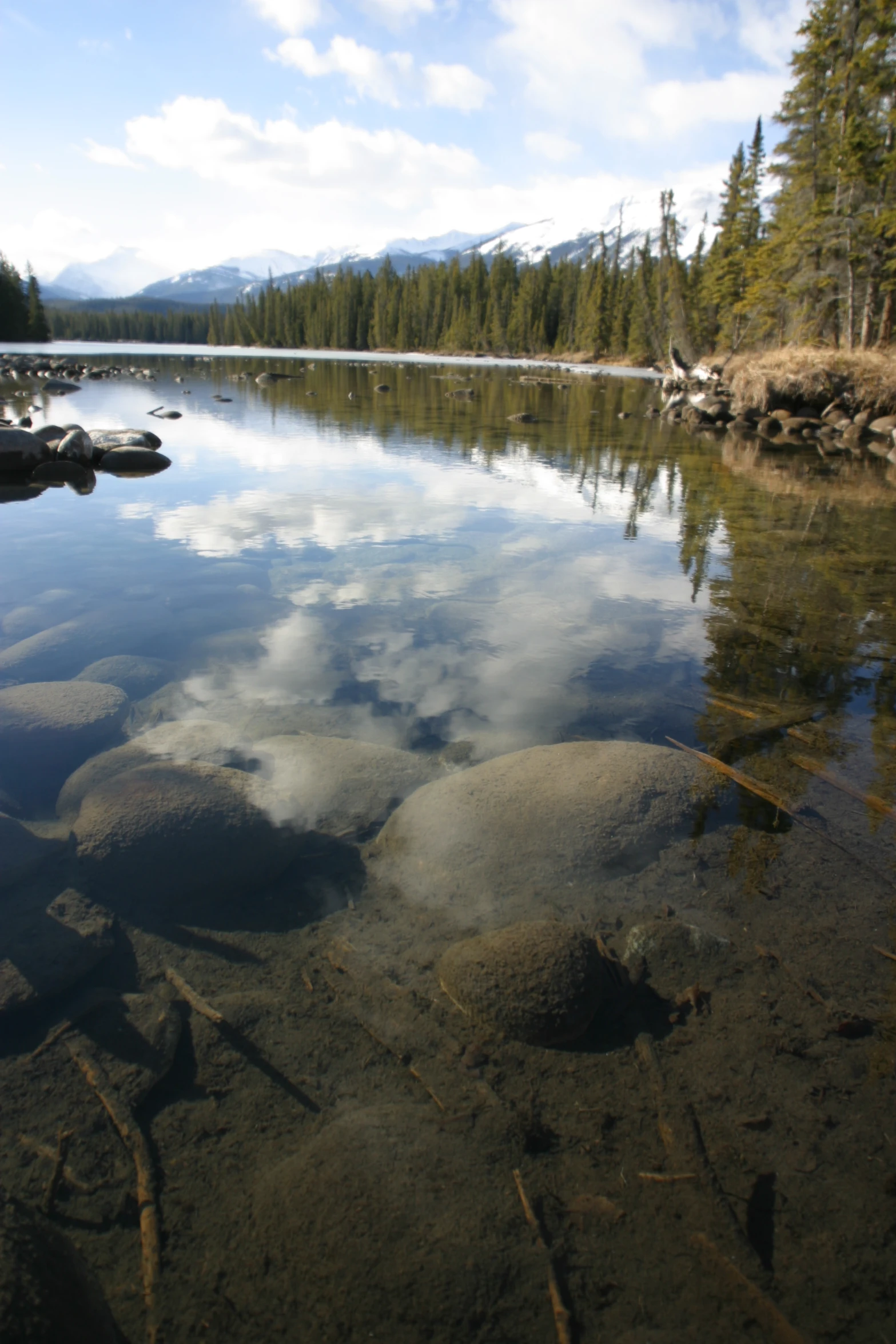 an empty lake surrounded by rocks and trees