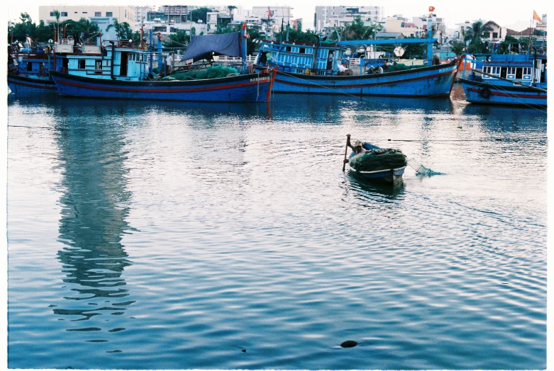 the boat is floating on the water in the marina