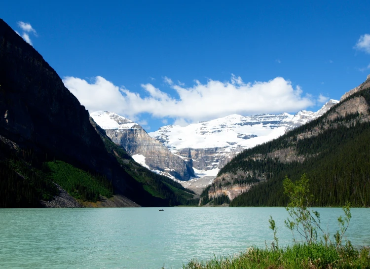 a wide view of a mountain and a lake in the mountains