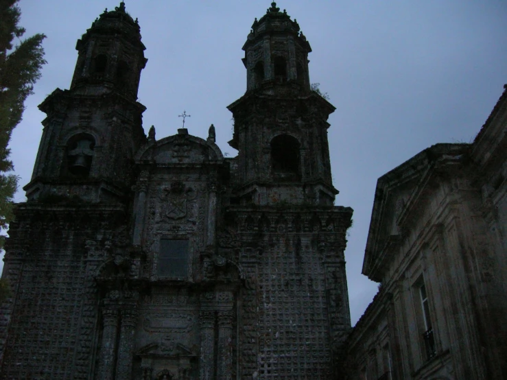 a large old church is next to tall buildings