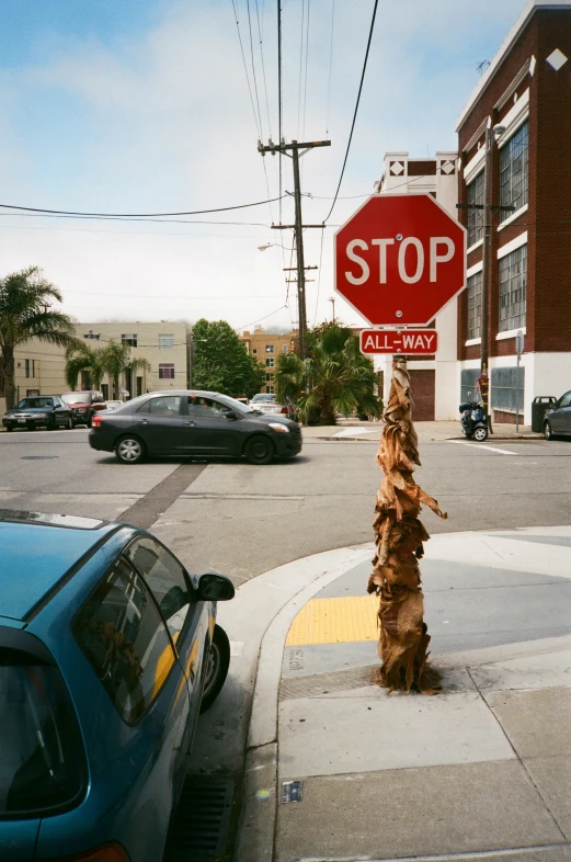 a stop sign sits at the end of the street