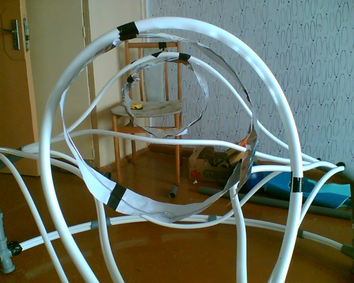 an odd object consisting of white wires and cords