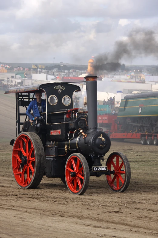 a person riding in an old fashioned steam engine