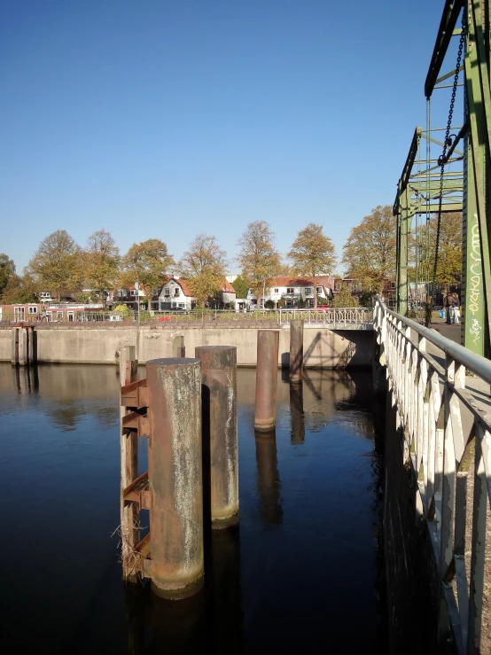 a view from across the water of a bridge and the river