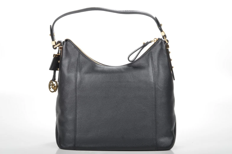 a black handbag that has gold hardware and a zipper closure