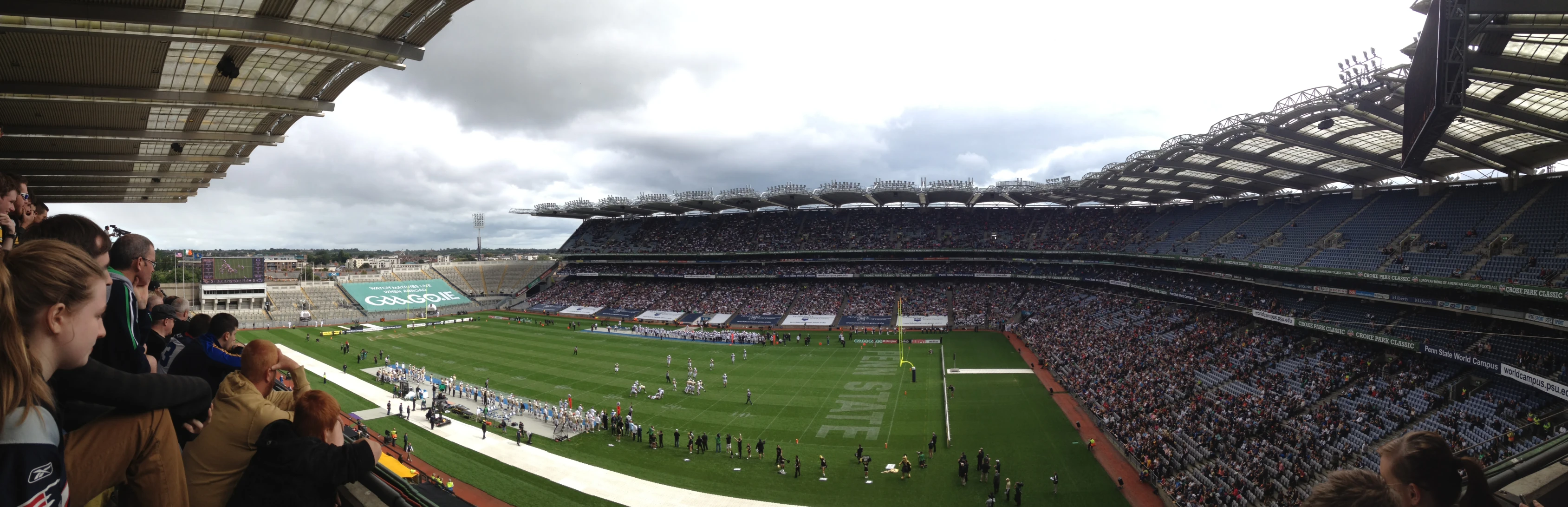 a stadium filled with lots of people watching soccer