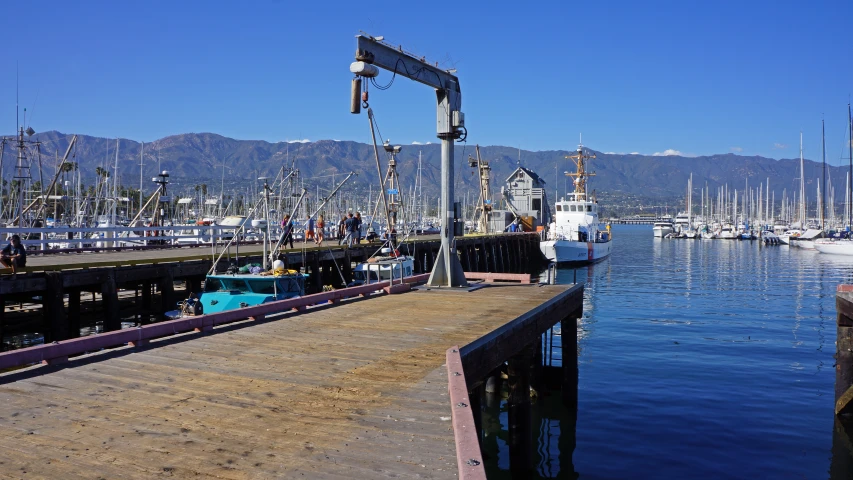 the docks are empty at the dock with sailboats