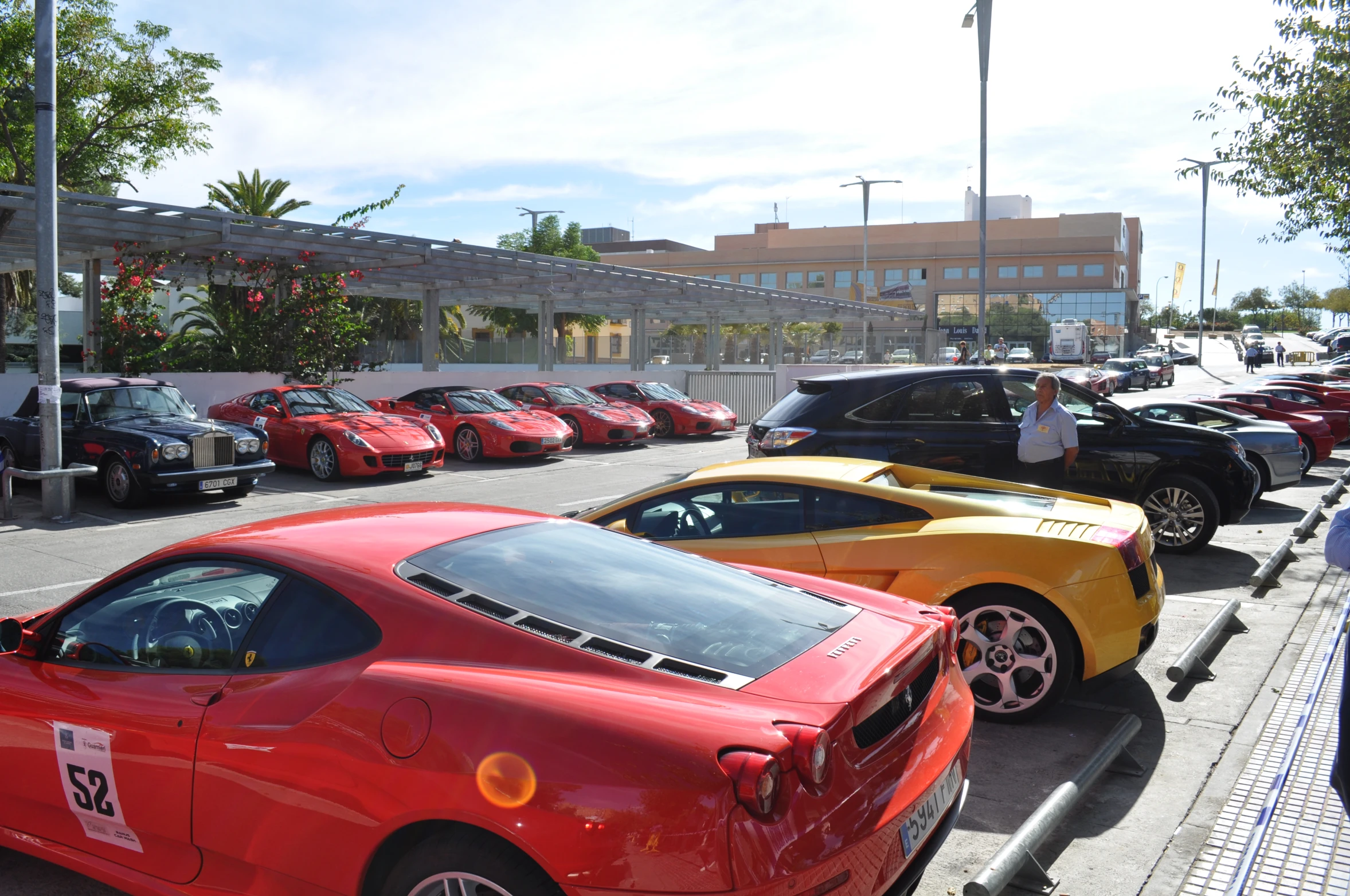 a red and yellow car parked next to a red and yellow car