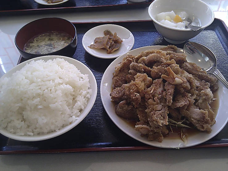 a close up of plates with food on a tray