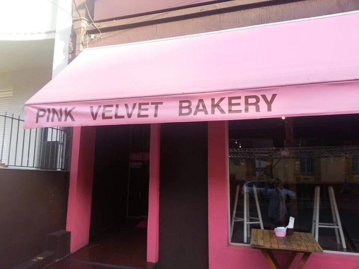 the entrance to the pink velvet bakery