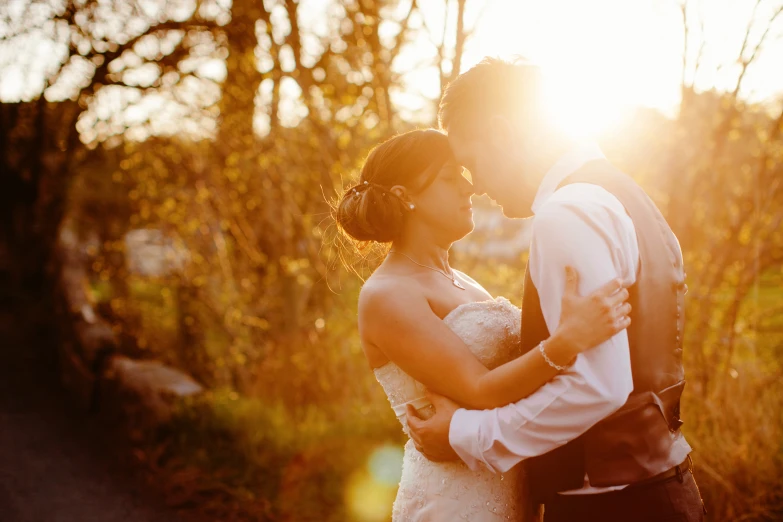 a bride and groom posing for the camera