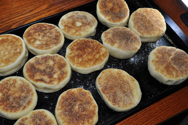 small pancakes sitting on a pan on a table