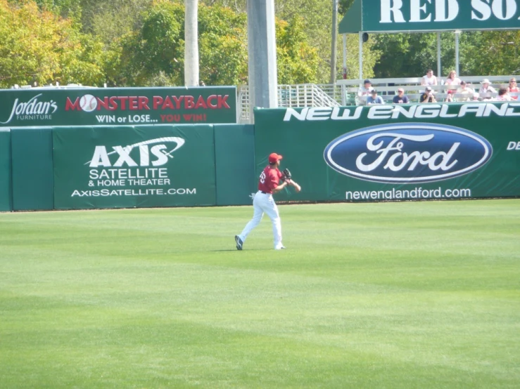 a baseball player walking across a field