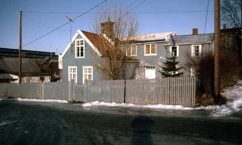 a po of a snowy day near a home