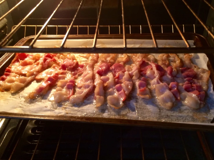 ham in oven being prepared for baking in an oven