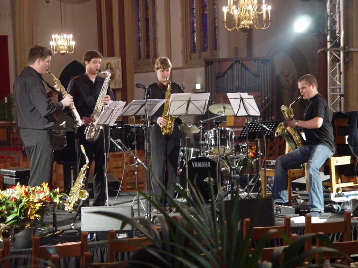 band performing in church with flowers in bloom