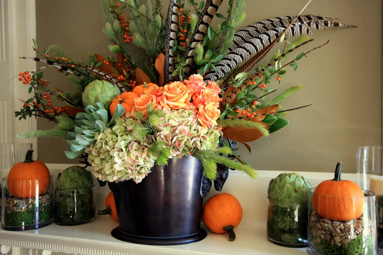 vases with plants and flowers are next to other decorations