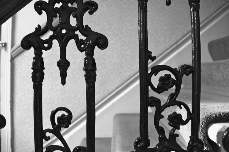 the staircase has been wrought iron with ornaments