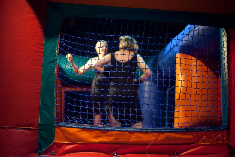 the children are playing in the bouncy castle