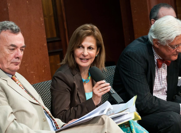 people sitting on the bench at a conference