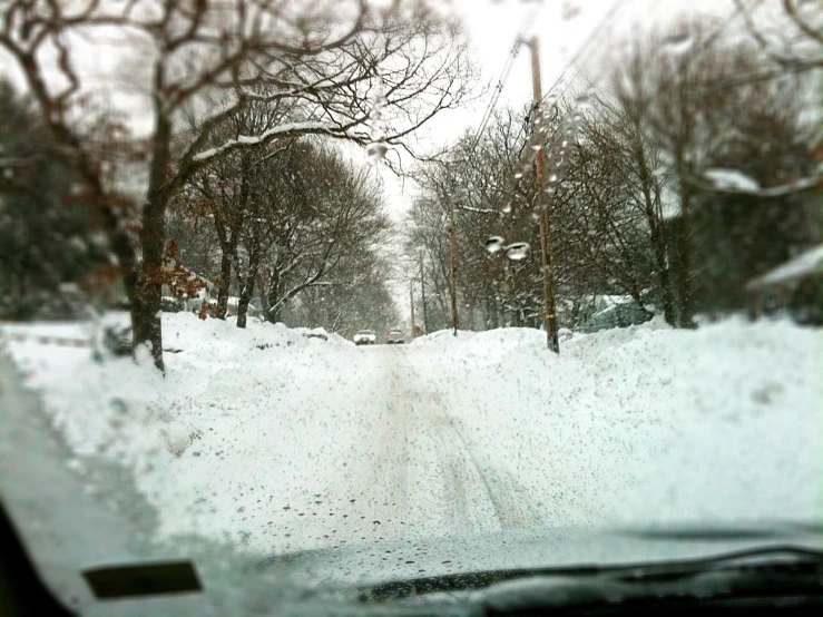 view from inside car, on a snowy road