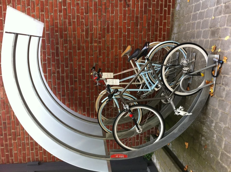 two bikes are parked on the metal steps