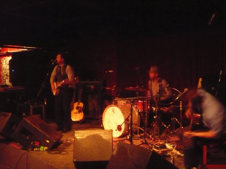 group of men in a dimly lit studio