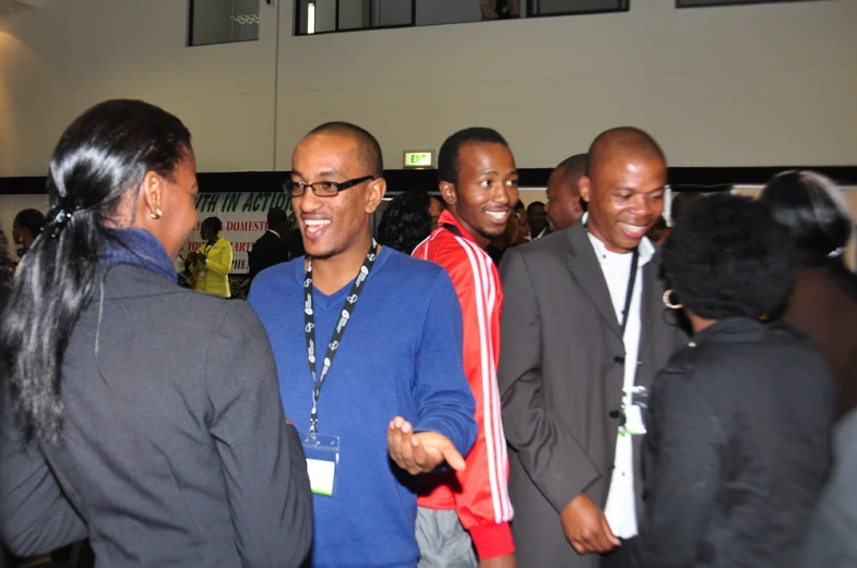 people are standing together and smiling for the camera