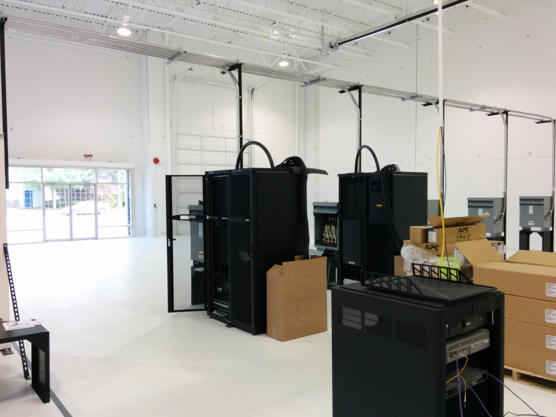 a room filled with black cabinets and computers