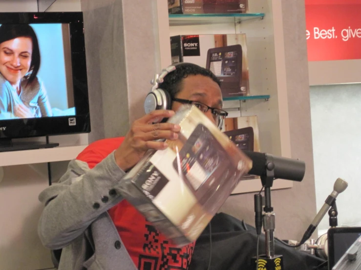 a man is in the studio with headphones to his ears