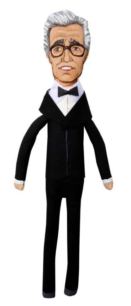 a stuffed older gentleman in a tuxedo