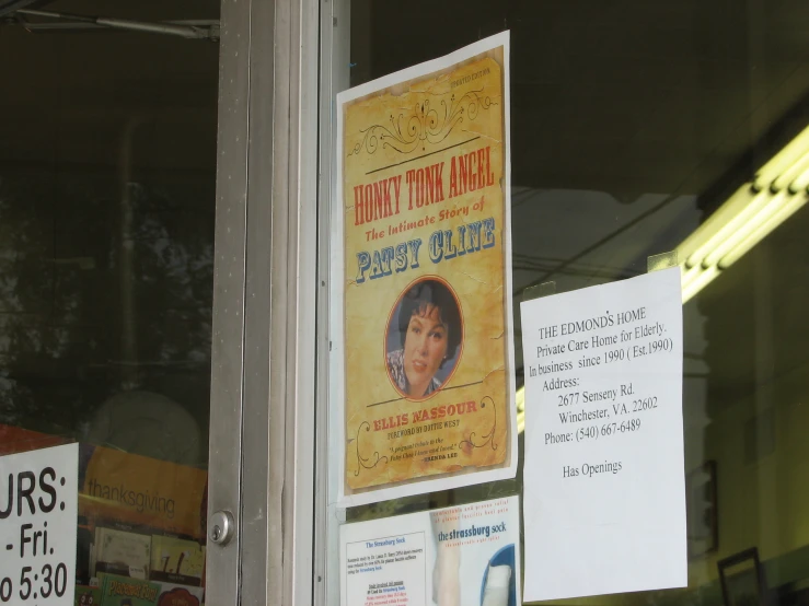 a poster on the side of a store window showing different characters