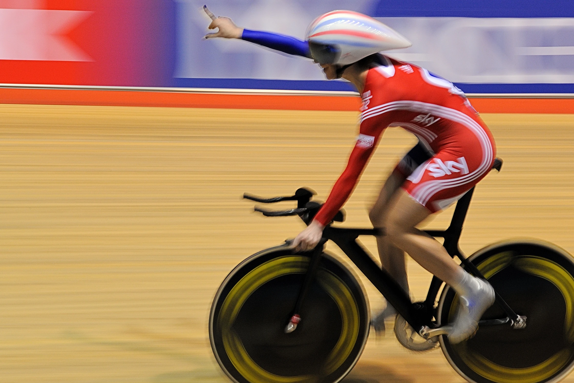 a male athlete on a speed bike riding the track