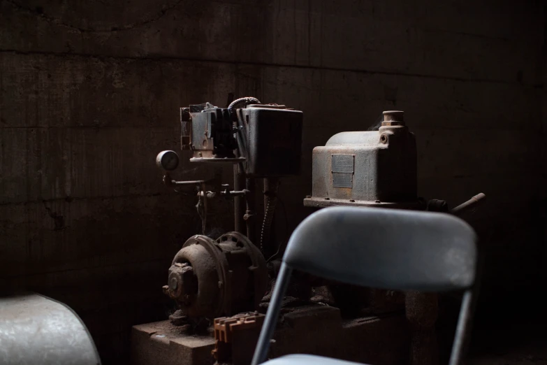 old industrial machine sitting by itself in the dark