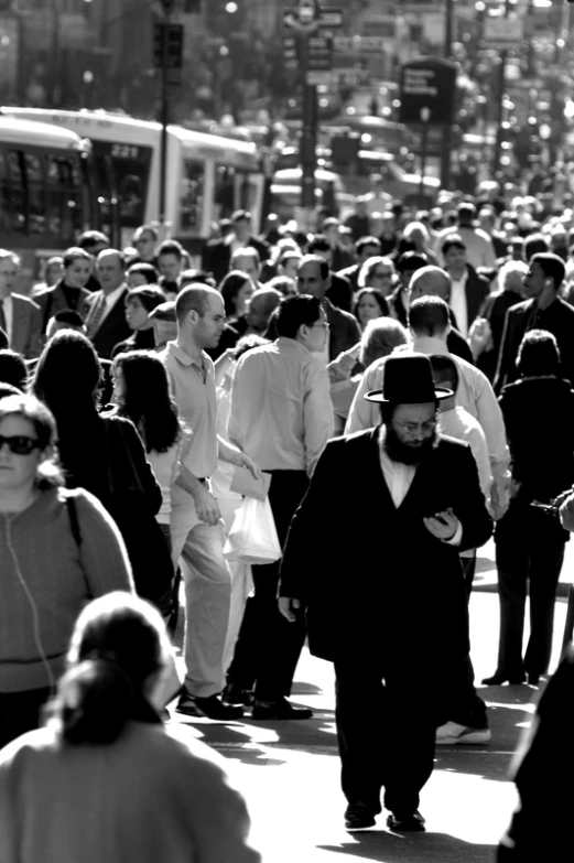 black and white pograph of people on street corner