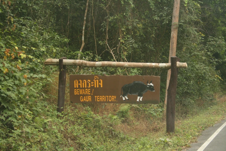 a sign on the side of the road indicating to reserve for cattle