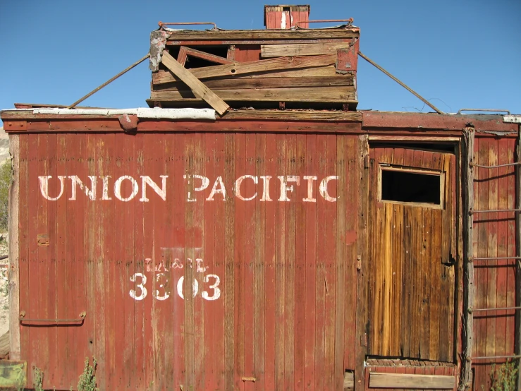 the word union pacific is on an old rusty red building