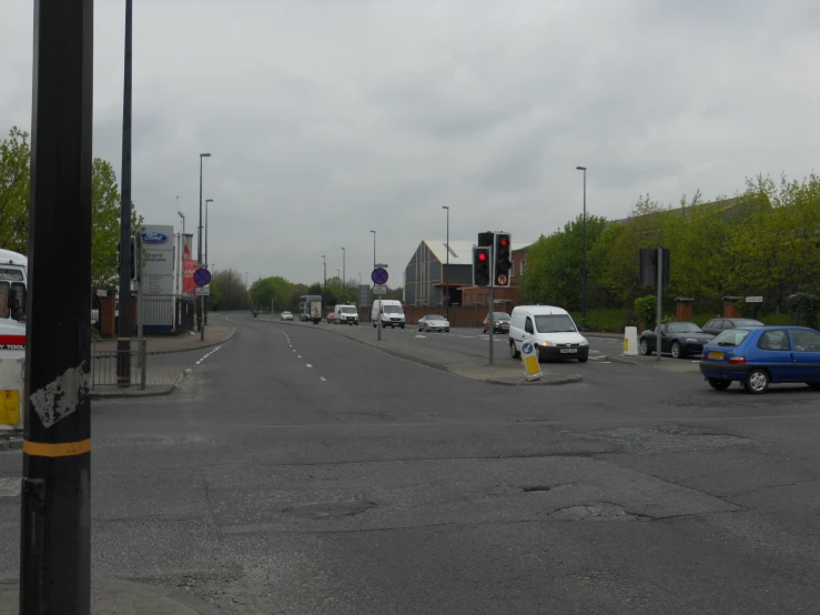 there are many vehicles at a street corner