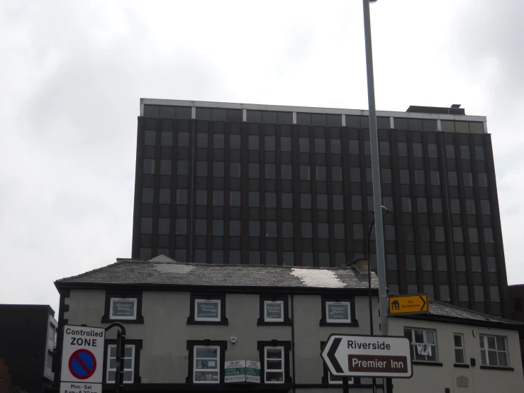 an old brick building near a large business