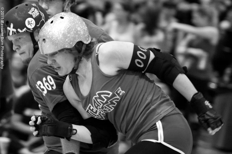 two athletes during a game playing roller skate