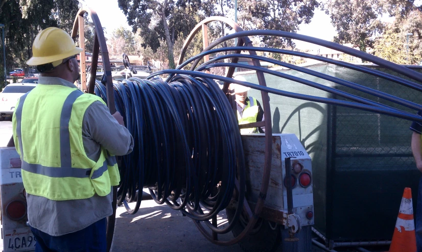 a man that is standing up with a bunch of wires