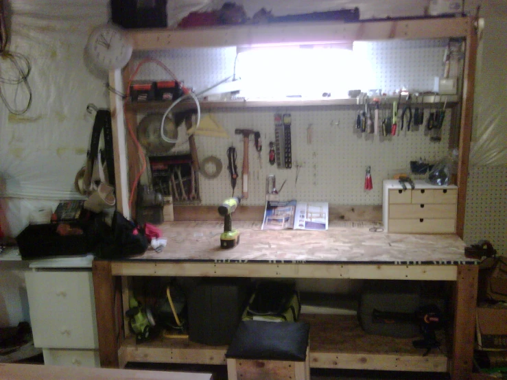 the workbench has several tools on it